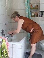 This naughty housewife loves to get kinky