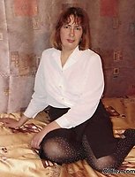 A mature blond takes of her clothes and pantyhose A mature blond takes of her clothes and pantyhose