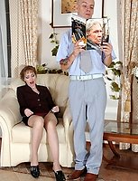 Lewd milf with an upskirt look ready to jump on a cock of a young co-worker
